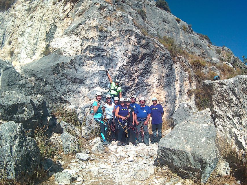 From Granada: 3-Hour Vía Ferrata in Moclín - Taking the zip line across the route