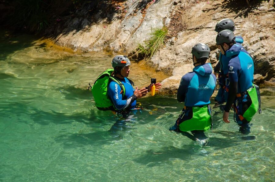 From Granada: Rio Verde Canyoning Tour with Lunch - Getting ready beside the river