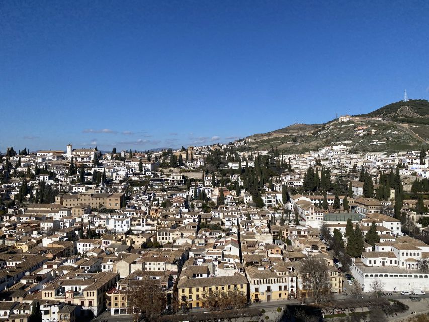Granada: Alhambra & Generalife Fast-Track Guided Tour - Charles V Palace and the layers of Granada’s past