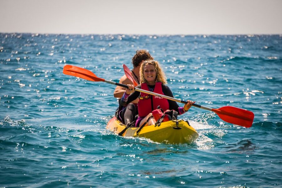 La Herradura: Cerro Gordo Natural Park Kayak & Snorkel Tour - Kayaking beside cliffs, beaches, and coves