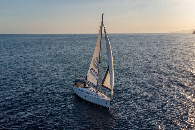 Sailing at sunset along the cliffs of Maro-Compartida - Why the Bavaria 37 makes a difference
