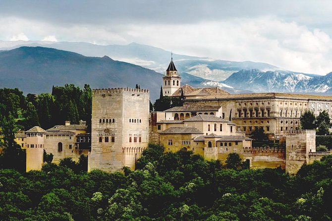 The Alhambra on its ridge with the snow line of the Sierra Nevada behind it
