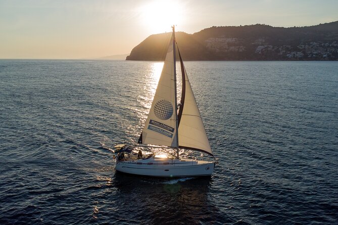 Sunset sailing along the cliffs of Maro- Private - Sailing west into the Maro sunset